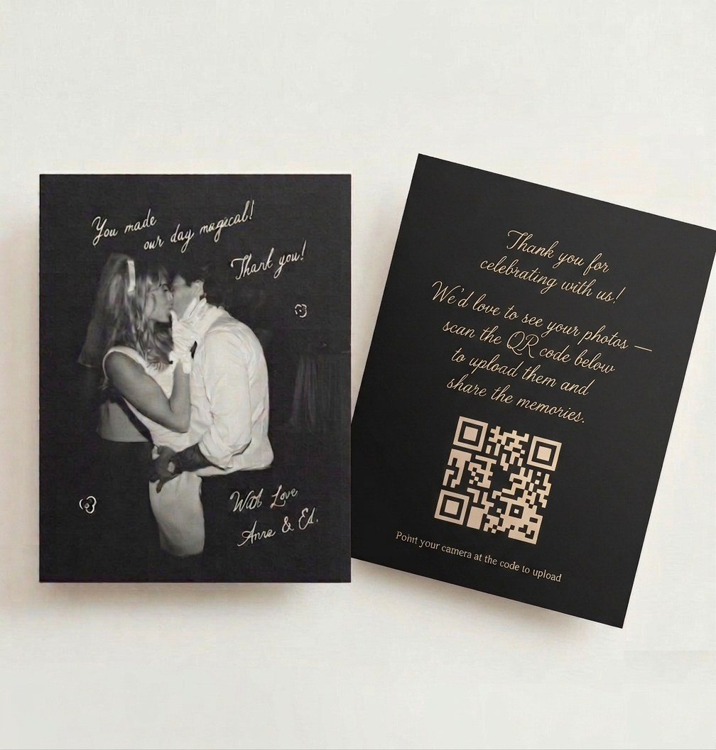 A black wedding thank-you card with a couple's first-dance photo on the front and a gold QR code on the back inviting guests to upload their photos