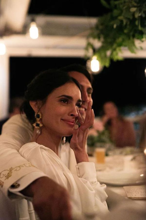 Bride smiling emotionally during mr and mrs questions about her