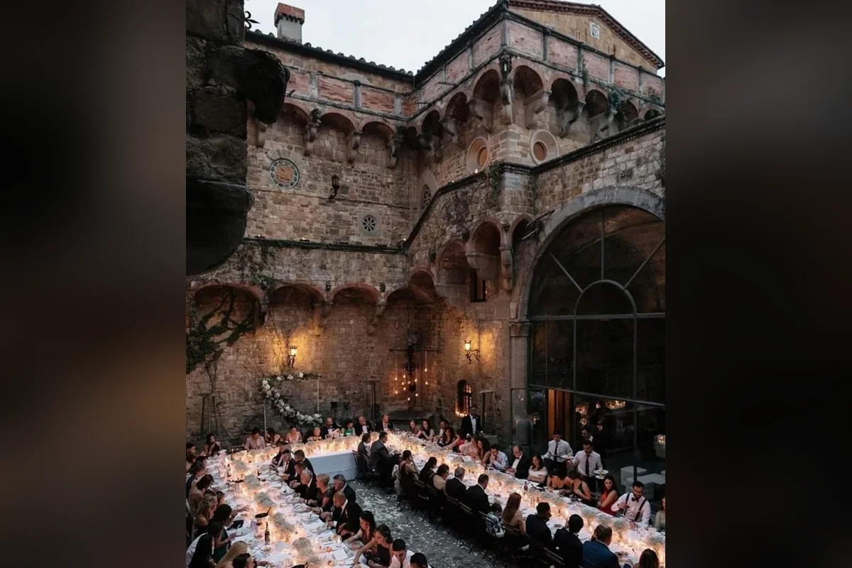 Candlelit wedding dinner in the courtyard of Castello di Vincigliata, Fiesole